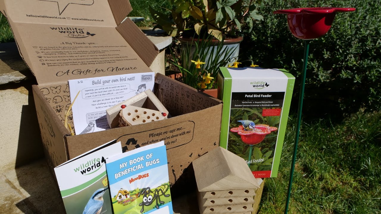 A Wildlife World gift box opened in a garden, from the unboxing film